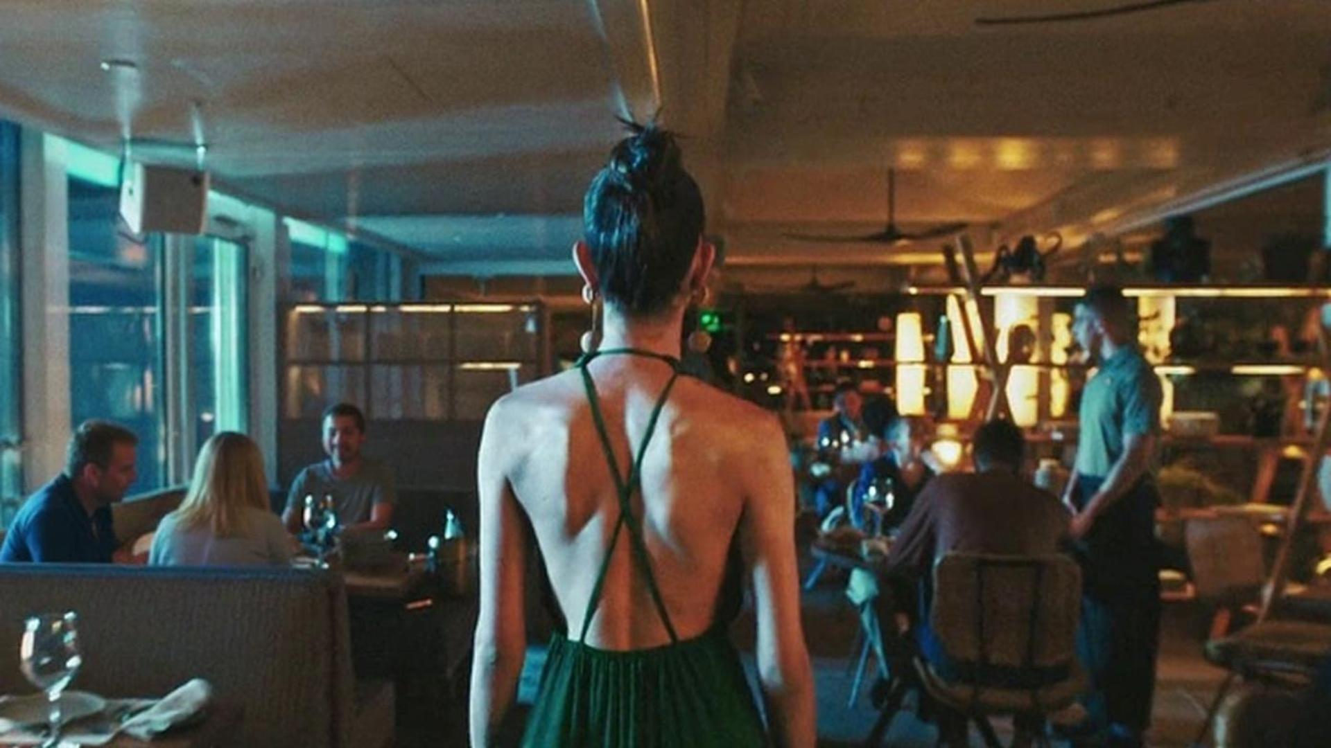 People in the restaurant admire the girl
