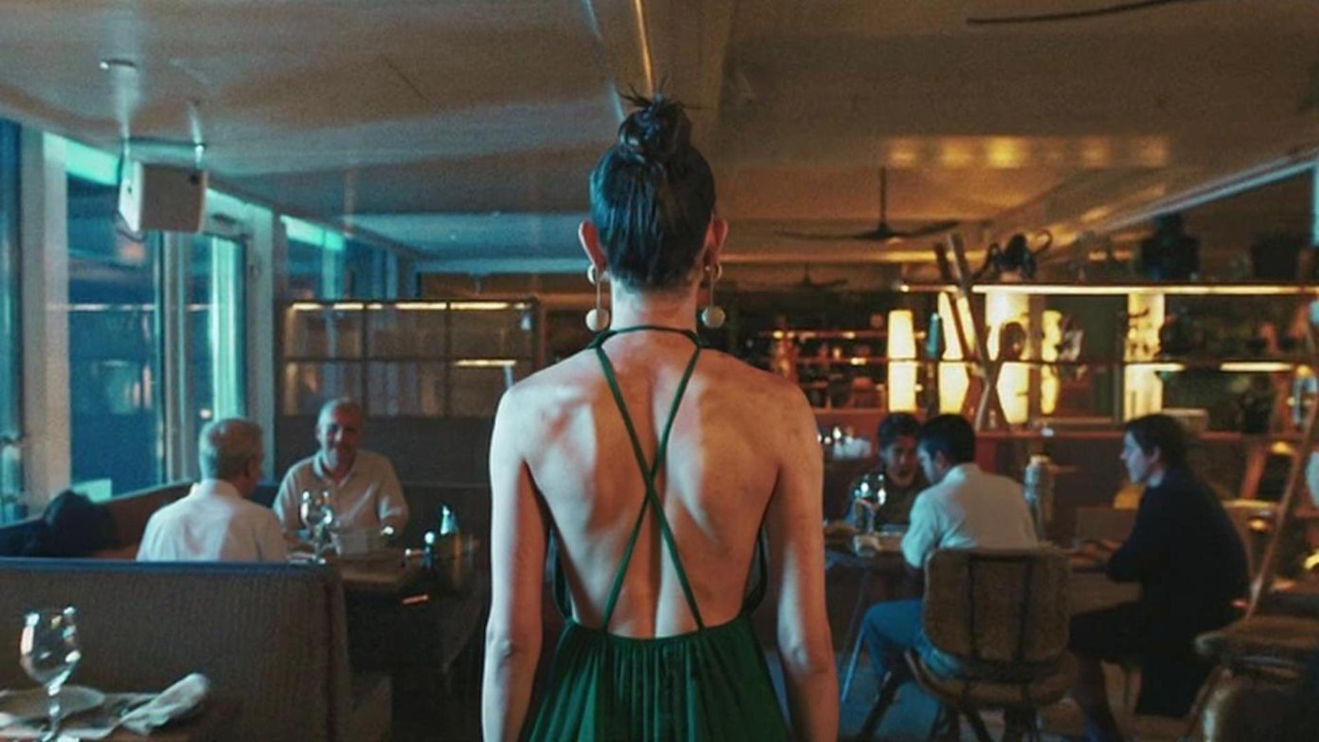 People in the restaurant admire the girl