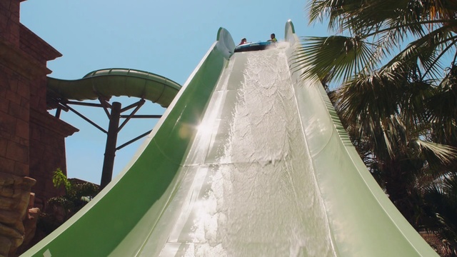 Video Reference N0: Sky, Tree, Chute, Shade, Leisure, Recreation, Arecales, Playground slide, Pole, Composite material