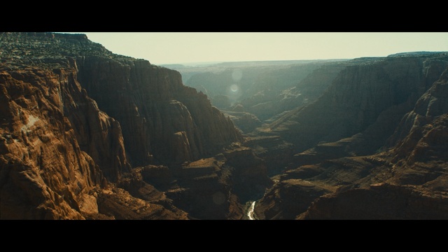 Video Reference N0: sky, rock, cliff, canyon, mountain, escarpment, atmosphere, terrain, highland, badlands