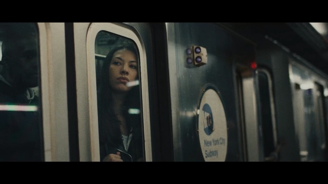 Video Reference N7: Face, Head, Transport, Snapshot, Lady, Photography, Fun, Black hair, Mouth, Public transport, Person, Train, Photo, Door, Looking, Window, Subway, Man, Standing, White, Black, Station, Bus, Silver, Refrigerator, Store, Display, Red, Room, Human face, Screenshot, Text, Mirror, Clothing