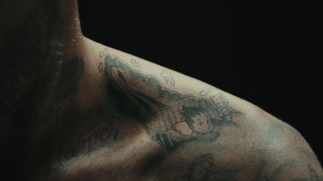 Video Reference N8: close up, arm, tattoo, facial hair, hand, chest, neck, darkness, flesh, macro photography