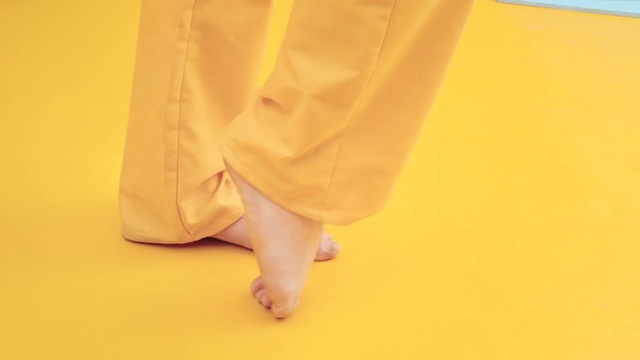 Video Reference N1: Yellow, Orange, Leg, Joint, Hand, Footwear, Barefoot, Photography, Foot, Finger