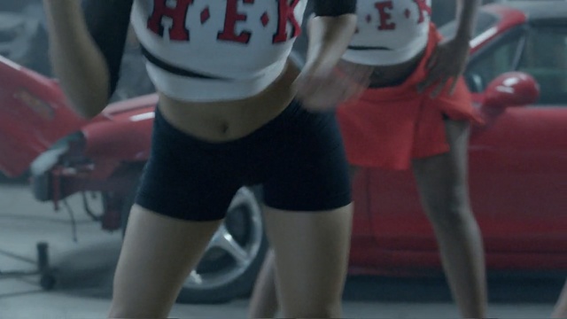 Video Reference N4: red, joint, leg, car, sport venue, girl, race, material, textile, recreation, Person