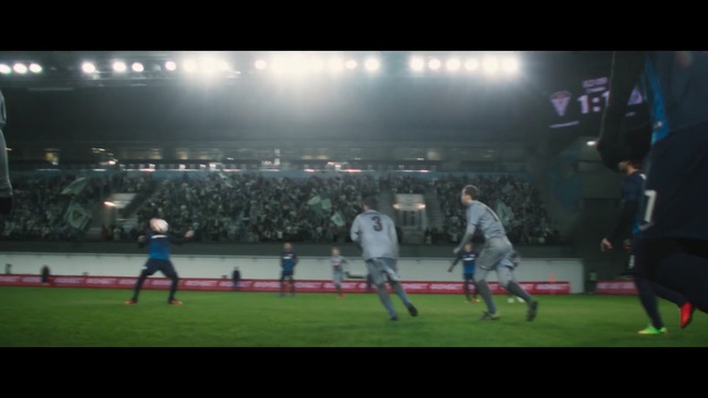 Video Reference N2: Player, Sport venue, Sports, Stadium, Tournament, Football player, Atmosphere, Ball game, Competition event, Team sport, Grass, Game, Playing, Ball, Baseball, Man, Large, Young, Holding, Monitor, People, Standing, Swinging, Field, Air, Group, White, Soccer, Person, Sports equipment, Football