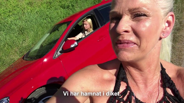 Video Reference N6: Vehicle, Car, Blond, Vehicle door, Photography, Mid-size car, Selfie, Smile, Subcompact car, Driving, Person, Grass, Outdoor, Man, Wearing, Smiling, Posing, Red, Woman, Black, Holding, Sitting, Young, Standing, Glasses, Riding, White, Motorcycle, Dog, Phone, Mirror, Street, Land vehicle, Human face, Wheel, Clothing
