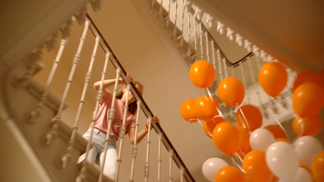 Video Reference N1: yellow, orange, ceiling, balloon, interior design, Person