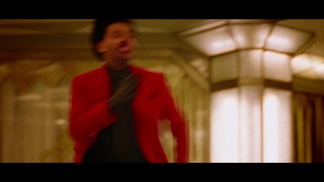 Video Reference N6: Red, Standing, Fun, Formal wear, Fictional character, Movie, Scene, Photography, Suit, Screenshot