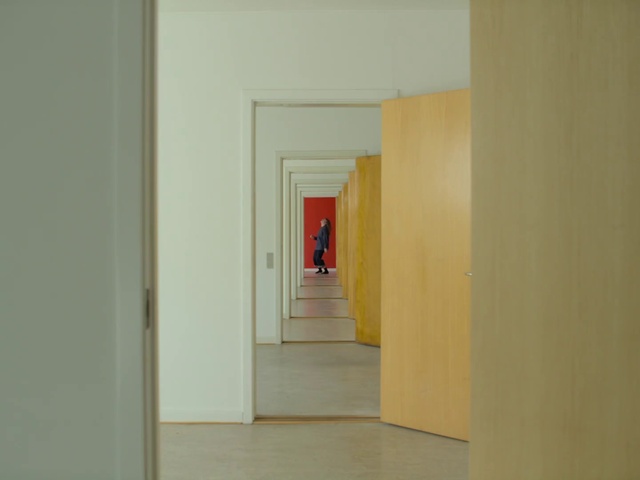 Video Reference N1: Room, Yellow, Wall, Floor, House, Line, Building, Interior design, Material property, Plaster