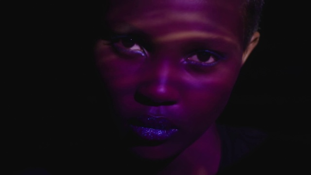 Video Reference N6: Face, Purple, Violet, Black, Head, Light, Beauty, Nose, Darkness, Pink
