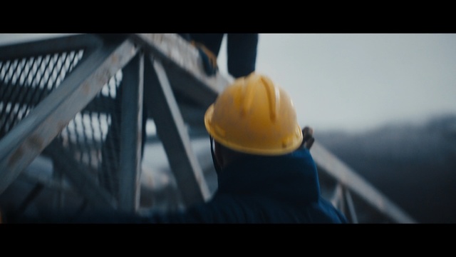 Video Reference N0: Hard hat, Helmet, Personal protective equipment, Yellow, Hat, Headgear, Fashion accessory, Photography, Cap, Table, Sitting, Orange, Photo, Computer, Food, Dark, Laptop, Black, Man, Keyboard, Wooden, Bridge, Cat, Holding, White, Blue, Standing, Room
