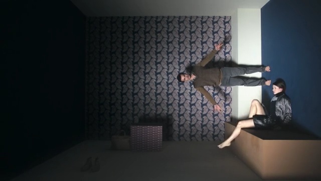 Video Reference N0: room, darkness, flooring, space, angle, floor, interior design, Person