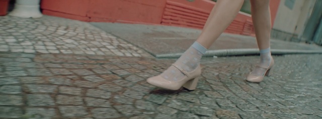 Video Reference N1: footwear, floor, shoe, flooring, leg, foot, road surface, cobblestone, human leg, outdoor shoe
