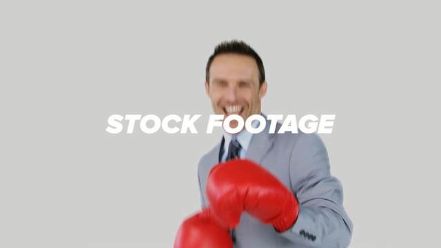 Video Reference N0: boxing equipment, shoulder, boxing glove, megaphone, arm, neck, microphone, Person