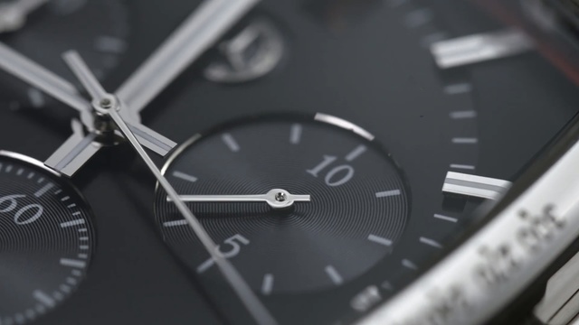 Video Reference N11: watch, photography, close up, product, black and white, font, brand, metal, strap, monochrome