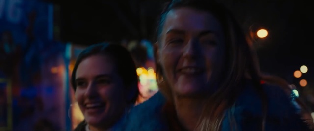 Video Reference N1: Face, People, Head, Fun, Forehead, Human, Night, Smile, Darkness, Event, Person, Man, Looking, Holding, Camera, Standing, Front, Photo, Posing, Glasses, Shirt, Food, Smiling, Close, Glass, Wine, Red, Young, Table, Large, Woman, Pizza, Plate, Sign, White, Street, Blue, Phone, Human face, Clothing