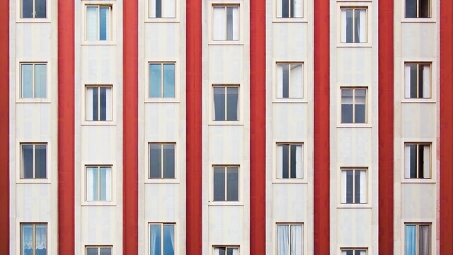 Video Reference N7: building, window, facade, symmetry, door, apartment, angle, house, pattern, bookcase, Person