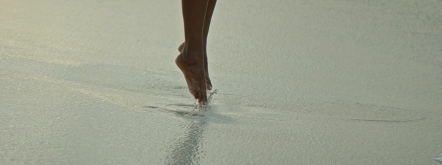 Video Reference N2: leg, water, sand, hand, foot, shoe, vacation, human leg, floor, flooring