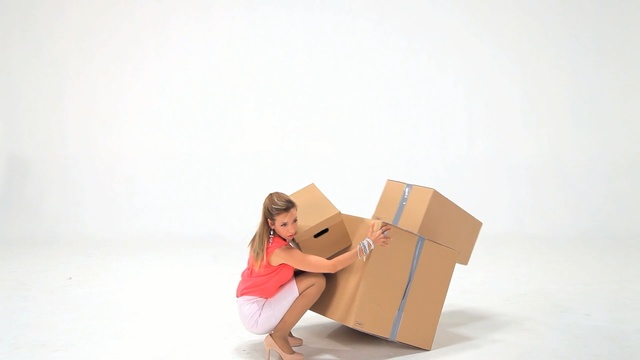 Video Reference N4: Cardboard, Pink, Carton, Box, Sitting, Paper product, Packaging and labeling, Paper bag, Package delivery, Smile