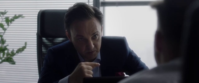 Video Reference N1: Face, Sitting, Mouth, Room, Photography, White-collar worker, Neck, Comfort, Furniture, Couch, Person, Indoor, Window, Man, Looking, Front, Laptop, Table, Computer, Desk, Food, Mirror, Holding, Woman, Young, Suit, Shirt, Cat, Human face, Clothing, Staring