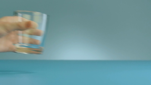 Video Reference N3: blue, water, product, close up, hand, glass, sky, transparency and translucency, computer wallpaper, liquid