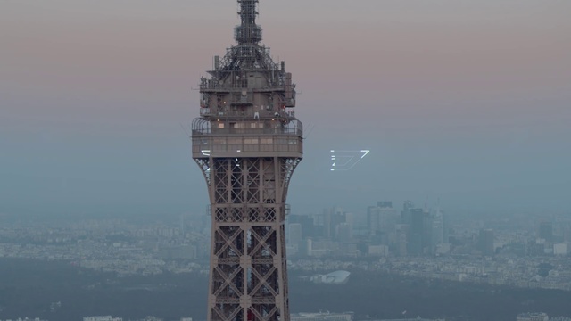 Video Reference N4: Landmark, Tower, Atmospheric phenomenon, Skyscraper, Metropolis, City, Architecture, Observation tower, Spire, Building, Outdoor, Water, Mountain, Large, Background, View, Boat, Body, Ship, River, Clock, Front, White, Tall, Ocean, Lake, Bridge, Flying, Fog, Sky