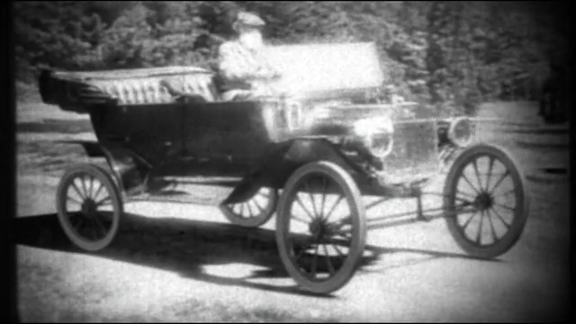 Video Reference N1: car, motor vehicle, black and white, vehicle, vintage car, mode of transport, monochrome photography, automotive design, carriage, wagon