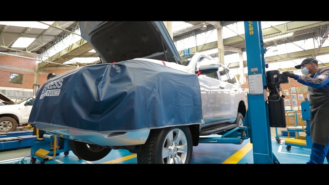 Video Reference N3: car, motor vehicle, vehicle, automotive design, automobile repair shop, automotive exterior, wheel, automotive wheel system, bumper, auto part