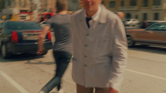 Video Reference N0: car, suit, road, street, jeans, vehicle, outerwear, gentleman, jacket, blazer