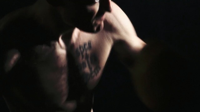 Video Reference N0: man, darkness, facial hair, muscle, human body, arm, human, hand, neck, performance art
