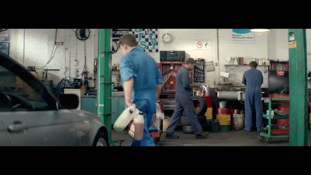 Video Reference N1: Automobile repair shop, Motor vehicle, Auto mechanic, Snapshot, Standing, Mode of transport, Arm, Vehicle, Car, Auto part, Person