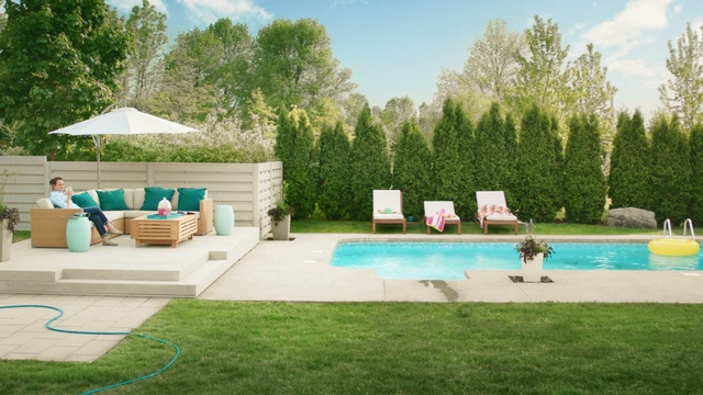 Video Reference N1: swimming pool, property, leisure, backyard, yard, estate, grass, outdoor furniture, lawn, landscape, Person