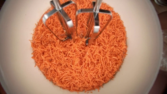 Video Reference N0: Food, Cuisine, Dish, Ingredient, Vermicelli, Recipe, Fideo, Cake, Plate, Table, Indoor, Chocolate, White, Sitting, Slice, Piece, Brown, Spoon, Eaten, Fork, Bowl, Covered, Toppings, Plant, Orange