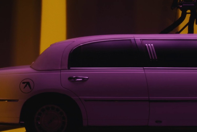 Video Reference N1: Land vehicle, Vehicle, Car, Luxury vehicle, Full-size car, Pink, Yellow, Limousine, Sedan, Lincoln town car