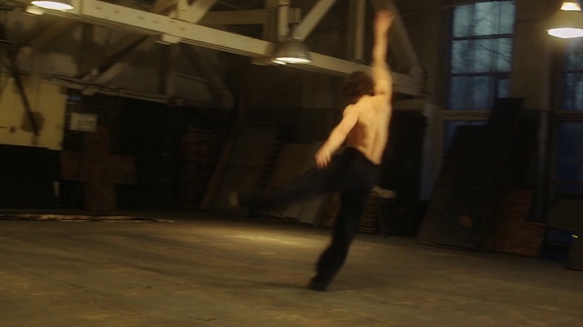 Video Reference N4: Dance, Dancer, Performance art, Choreography, Performing arts, Modern dance, Floor, Performance, Room, Event, Person, Man, Indoor, Building, Riding, Board, Jumping, Air, Young, Wearing, Shirt, Doing, Trick, Standing, Blurry, White, Pizza, Footwear, Clothing