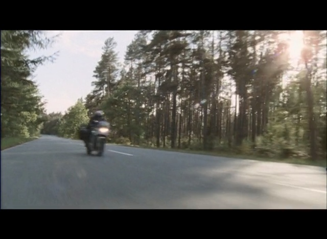Video Reference N4: Motorcycle, Nature, Mode of transport, Asphalt, Vehicle, Tree, Road, Motorcycling, Morning, Lane, Person