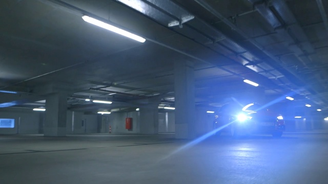 Video Reference N10: Light, Parking lot, Lighting, Parking, Public space, City, Security lighting, Ceiling, Darkness, Building