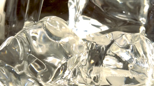 Video Reference N7: Transparent material, Water, Glass, Crystal, Person, Table, Sitting, Glasses, Clear, Bag, Food, Wrapped, Cake, Close, Large, Black, Knife, Wine, Plate, White, Group, Covered, Sandwich, Red, Man, Cheese, Laying, Bottle, People, Fluid, Liquid