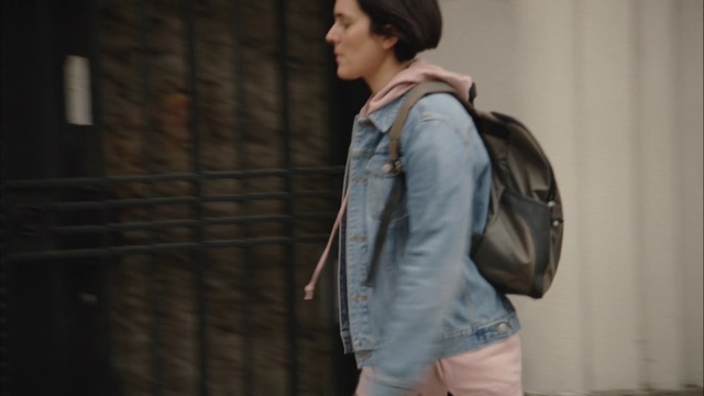 Video Reference N3: Denim, Jeans, Clothing, Shoulder, Jacket, Fashion, Outerwear, Standing, Snapshot, Leather, Person, Indoor, Young, Holding, Suitcase, Woman, Man, Luggage, Front, Boy, Room, Using, Wearing, Shirt, Walking, Playing, Remote, Living, Video, Board, Suit, Phone, White, Wall, Coat, Trousers, Human face, Luggage and bags, Handbag, Street fashion, Sleeve