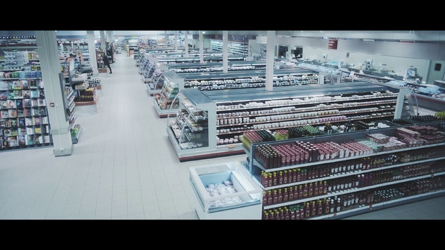 Video Reference N4: Product, Electronics, Urban area, Supermarket, Building, Metropolis, Urban design, Architecture, Commercial building, Convenience store