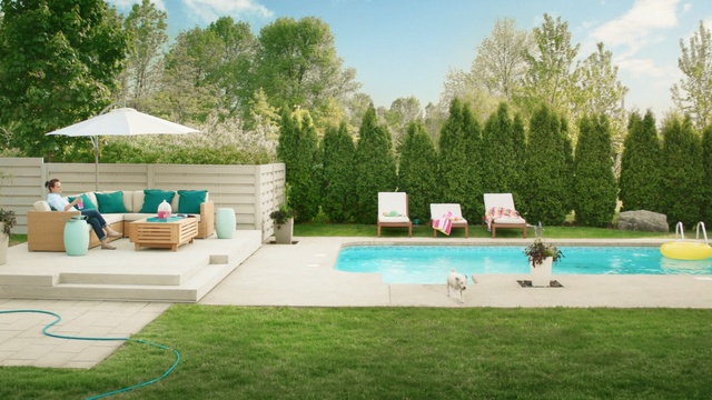 Video Reference N3: swimming pool, property, leisure, backyard, yard, estate, grass, outdoor furniture, landscape, real estate, Person