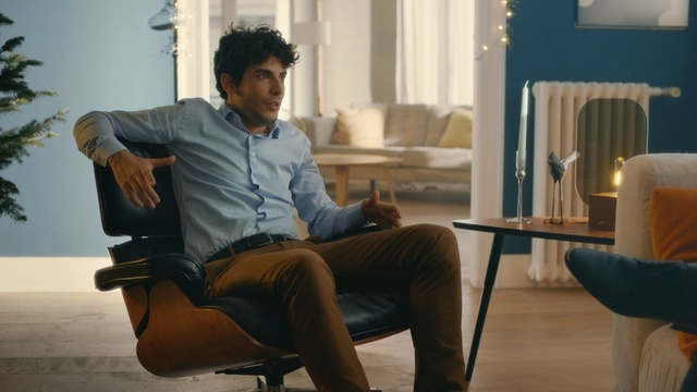 Video Reference N1: furniture, sitting, chair, table, couch, interior design, conversation, Person