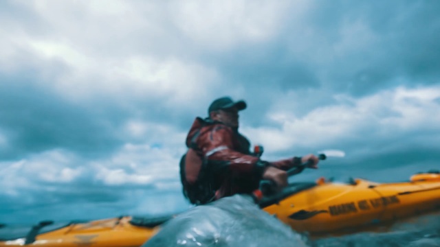 Video Reference N2: kayak, water, sea kayak, boat, vehicle, cloud, sky, watercraft, kayaking, sea