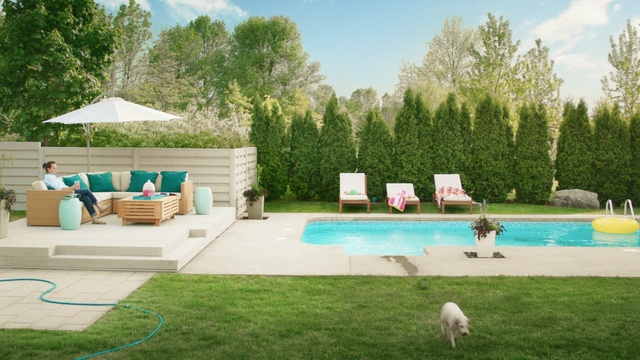 Video Reference N2: swimming pool, property, backyard, leisure, yard, grass, estate, outdoor furniture, lawn, home, Person