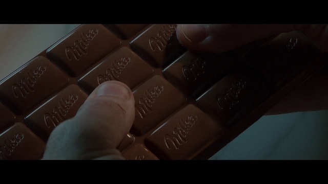 Video Reference N2: Chocolate, Brown, Nail, Hand, Chocolate bar, Finger, Leather