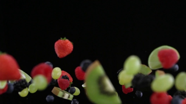 Video Reference N5: Plant, Food, Still life photography, Fruit, Macro photography, Flower, Sweetness, Petal, Berry, Seedless fruit, Indoor, Cake, Table, Plate, Black, Sitting, Decorated, Banana, Apple, Close, Red, White, Made, Salad, Standing, Blue, Dish