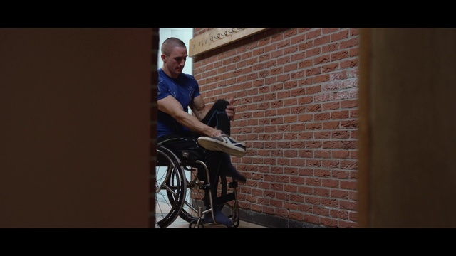 Video Reference N2: Sitting, Photograph, Wheelchair, Arm, Snapshot, Shoulder, Leg, Wall, Joint, Human