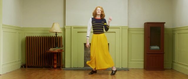 Video Reference N9: clothing, yellow, dress, standing, shoulder, fashion, joint, girl, flooring, trunk, Person