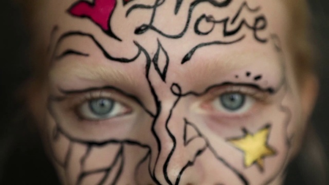 Video Reference N9: Face, Forehead, Skin, Cheek, Tattoo, Head, Eyebrow, Arm, Nose, Eye