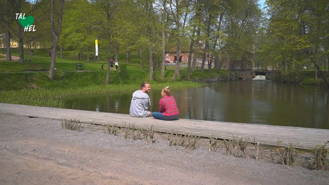Video Reference N0: Water, Waterway, Bank, River, Canal, Tree, Watercourse, Leisure, Pond, Bayou, Person, Outdoor, Grass, Bench, Park, Sitting, Man, Building, Sidewalk, Side, Little, Standing, Wooden, Lake, Street, Red, Young, Body, People, White, Ground, Clothing, Plant